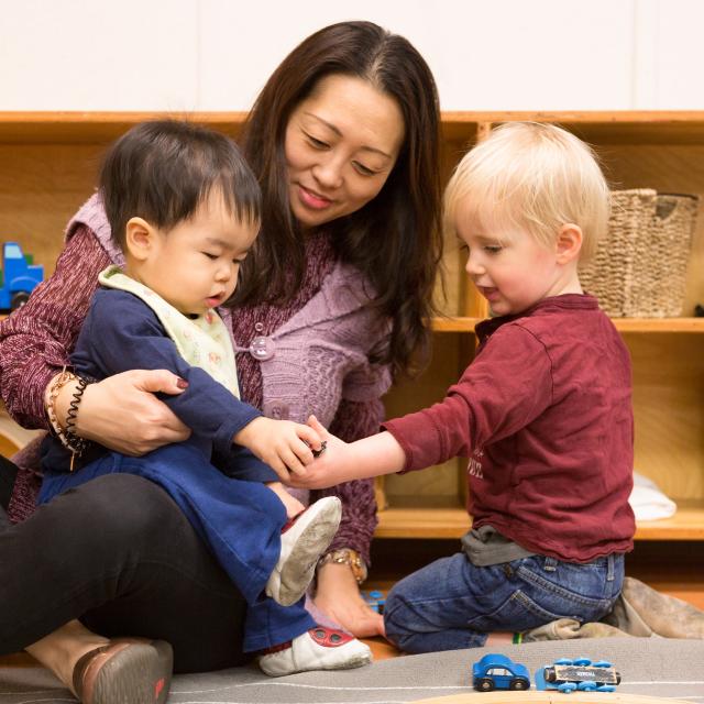 Children and care giver at Emma's Early Learning and Child Care Centre
